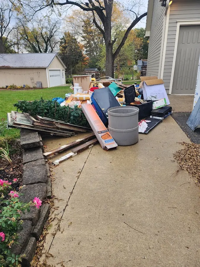 Dumpster being loaded with debris for Residential Dumpster Rental in New Garden